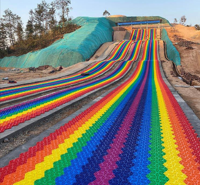 Building Rainbow Slides on Hillsides: Is Slope Reshaping and Soil Reinforcement Necessary?