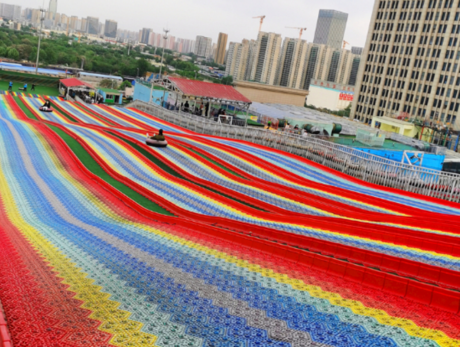 Rainbow Slides: The Versatile Attraction for Outdoor Entertainment