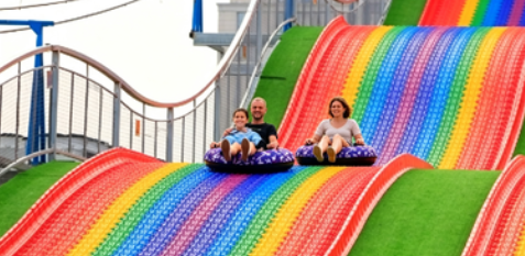 Eco-Friendly Dry Land Rainbow Slide: A Low-Impact, Turnkey Solution